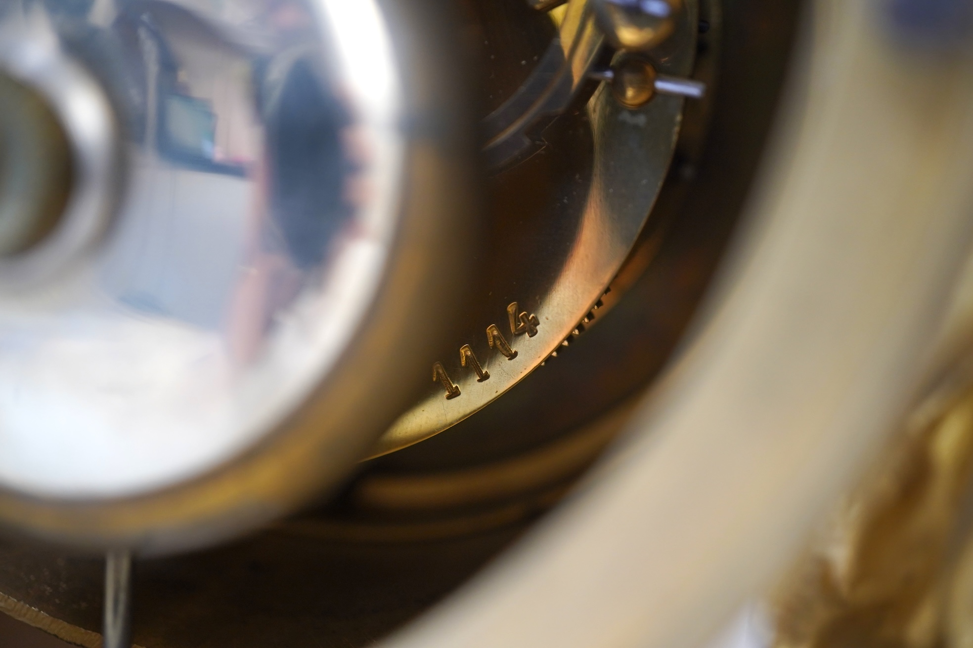 An early 19th century French figural ormolu and white marble mantel clock